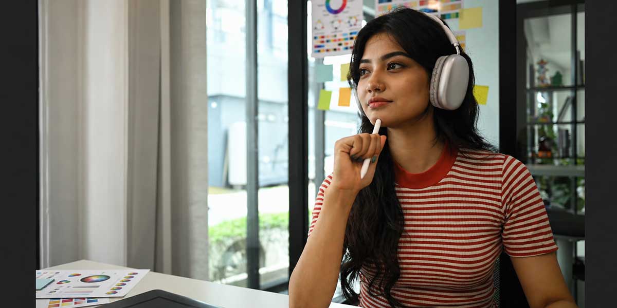 Candidate taking the Accenture AI-graded audio communication assessment with a wired headset